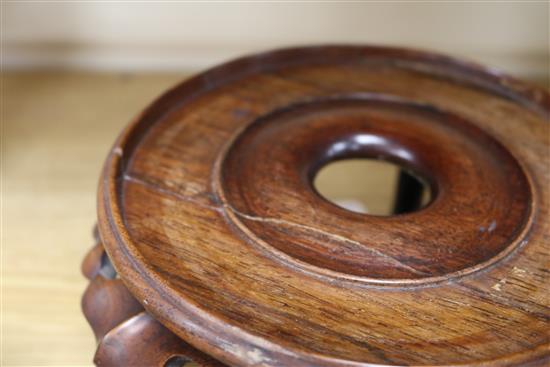 Two Chinese hardwood stands largest 20cm diameter